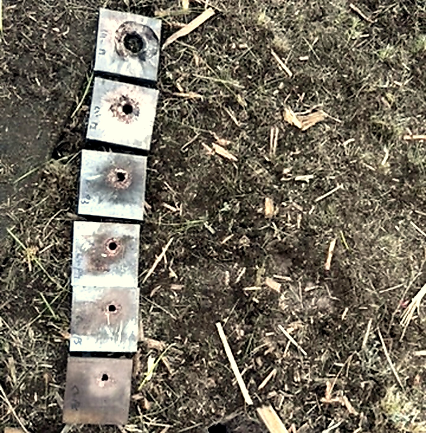 October 2026 test: 1 in A36 mild steel plates after test, per USK test data — company test photo
